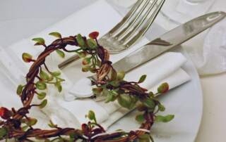 picture: Plate and cutlery with heart made of twigs and leaves